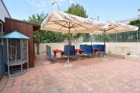 A patio or other outdoor area at B&B La Castellana