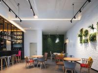 a restaurant with tables and chairs and a green wall at 康铂酒店深圳国际会展中心店 in Shenzhen