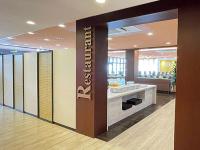 a lobby with a hotel sign on the wall at Rembrandt Inn Kazusa in Kimitsu