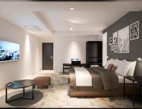 Un dormitorio con una cama grande y una mesa. en The Empress Hotel, en Daejeon