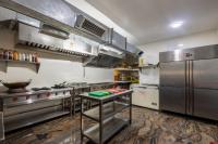 Η κουζίνα ή μικρή κουζίνα στο Hotel Delight Suites