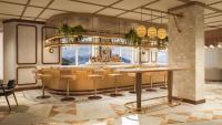 a rendering of a restaurant with a bar with stools at Rimrock Banff, Emblems Collection in Banff