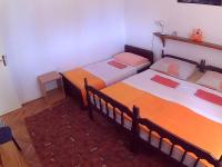 Postel nebo postele na pokoji v ubytování Apartments Ivana i Darko