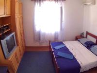 Postel nebo postele na pokoji v ubytování Apartments Ivana i Darko