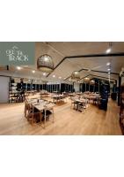 a restaurant with tables and chairs in a room at Havelock North Holiday Park in Havelock North