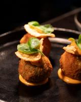 a group of small food items on a stove at Villa Tokay - The Luxury Resort in Gili Air