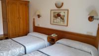 Postel nebo postele na pokoji v ubytování Hostal Centro