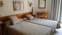 Postel nebo postele na pokoji v ubytování Hostal Centro