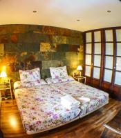 Posteľ alebo postele v izbe v ubytovaní Green Peaks B&B Country House Alojamiento Rural