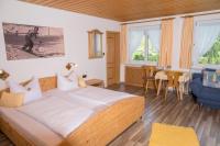 A bed or beds in a room at Haus Garni Luggi Leitner