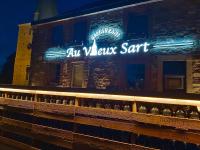 Et logo, certifikat, skilt eller en pris der bliver vist frem på El Sart