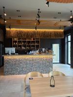 a restaurant with a bar with a table and chairs at Готель Горинський 