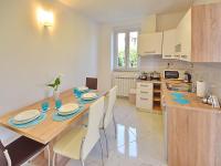 Kuchyňa alebo kuchynka v ubytovaní Apartments Garden Residence Opatija