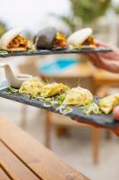 two plates of food on a tray on a table at Luxury Boutique Jacuzzi Chalet in Maro