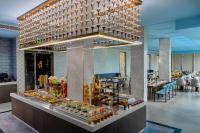 a buffet in a hotel with a large chandelier at Fortune Airport Road Kochi - Member ITC hotels' group in Cochin