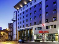 a building with a car parked in front of it at ibis Glasgow City Centre – Sauchiehall St in Glasgow