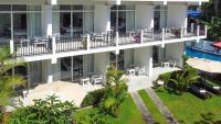 an aerial view of a building with tables and umbrellas at Weleges Place in Hikkaduwa