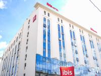 a building with a sign on top of it at Ibis Tunis in Tunis