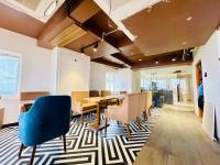 an office with a dining room with tables and chairs at Front Sea View Hotel ! Eastern-Dham Near Jagannath Temple - Fully Air Conditioning Luxuray Rooms-Free Wifi & Parking Facilities- Best Hotel In Puri in Puri