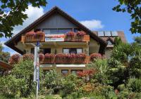 a building with flower boxes on its balconies at Haus Rose in Allensbach