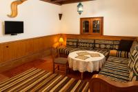 a living room with a couch and a table at Auberge la belle vue dades in Akhendachou nʼAït Ouffi