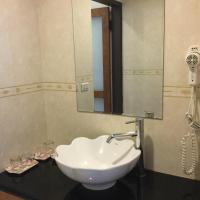 a white sink in a bathroom with a mirror at 闕麒景觀民宿Chill Villa B&amp;B in Puli