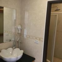 a bathroom with a sink and a mirror at 闕麒景觀民宿Chill Villa B&amp;B in Puli