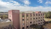 a building with a sign on the side of it at Hotel Agua del Desierto in Calama