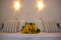 A bed or beds in a room at Frida Apartments