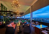 a restaurant with a view of a city at night at Hatten Hotel Super Sea View 4pax High Floor FREE 1 Carpark & Netflix with 2 TV Room in Melaka