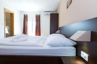 Posteľ alebo postele v izbe v ubytovaní Plitvice Palace