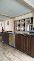 a lobby with a large counter with a sign on it at Hotel Machu Picchu Selva in San Antonio