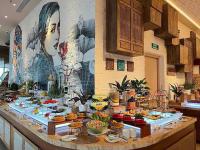 a buffet of food on a table in a kitchen at Luxanova Panorama Condotel in Nha Trang
