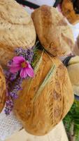 a bunch of loaves of bread with a flower on it at Pensiunea Agroturistica Cerna, Vaideeni - Polovragi in Vaideeni