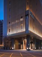 a building with lights on the side of it at Hotel Dùa in Kaohsiung