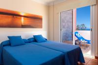 Postel nebo postele na pokoji v ubytování Apartamentos Terrazas Los Gigantes by Suncanarias