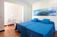 Postel nebo postele na pokoji v ubytování Apartamentos Terrazas Los Gigantes by Suncanarias
