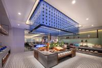 a restaurant with a buffet in the middle of a room at Novotel Hangzhou Xintiandi in Hangzhou