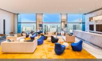 a living room with a view of the city at The Prince Gallery Tokyo Kioicho, a Luxury Collection Hotel in Tokyo