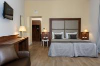 A bed or beds in a room at Navona Luxury Guesthouse