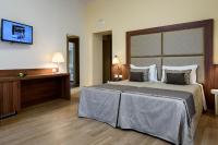 A bed or beds in a room at Navona Luxury Guesthouse