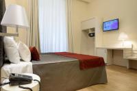 A television and/or entertainment centre at Navona Luxury Guesthouse