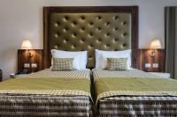 A bed or beds in a room at Navona Luxury Guesthouse