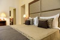 A bed or beds in a room at Navona Luxury Guesthouse
