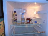 an open refrigerator with food and drinks in it at Les Galets in Tracy-sur-Mer