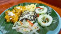 a plate of food on top of a banana leaf at Finca Agroturística Rosita in San Luis de Palenque