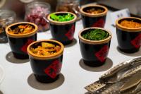 Un grupo de tazas de comida sobre una mesa. en YUNlK Hotel Harbin Central Street Sophia Cathedral, en Harbin