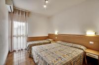 A bed or beds in a room at Residence Columbia