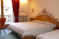 Hotel Garnì La Montanaraにあるベッド