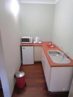 a small kitchen with a sink and a microwave at Caledon 31 in George